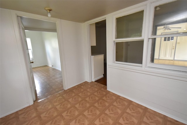 unfurnished room with light parquet flooring