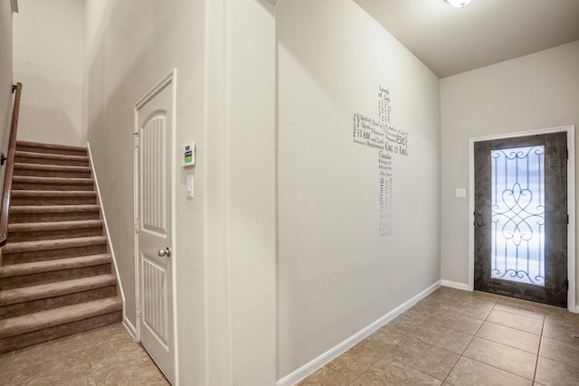 foyer entrance featuring light tile patterned flooring