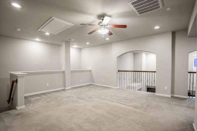 carpeted spare room with ceiling fan