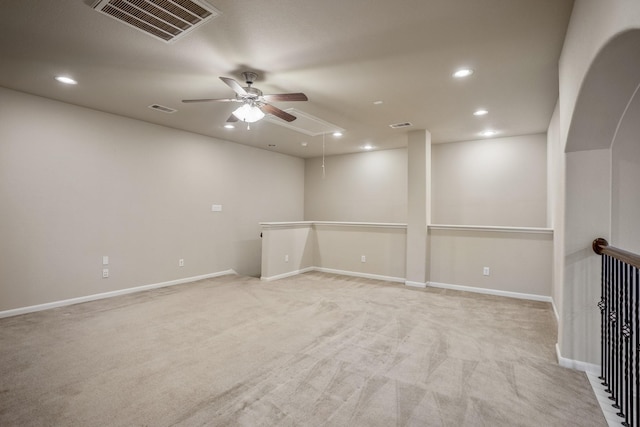 unfurnished room with light carpet and ceiling fan