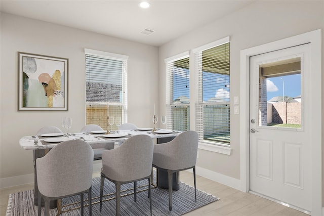 dining area featuring light wood-type flooring