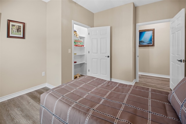 bedroom featuring hardwood / wood-style flooring