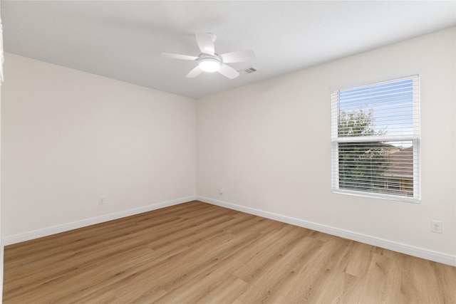 unfurnished room featuring ceiling fan and light hardwood / wood-style flooring