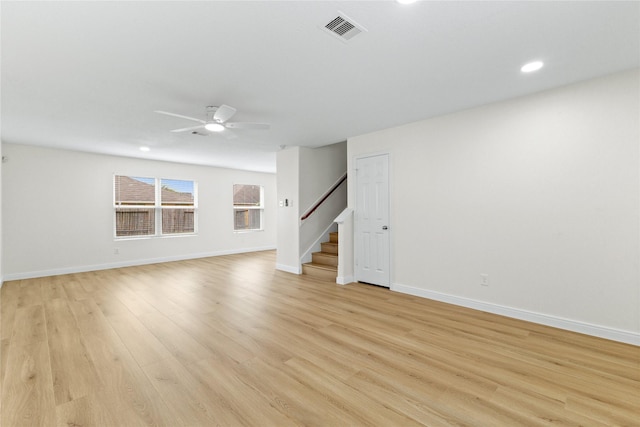 unfurnished living room featuring light hardwood / wood-style flooring and ceiling fan