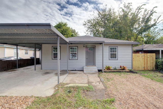 view of front facade with a carport