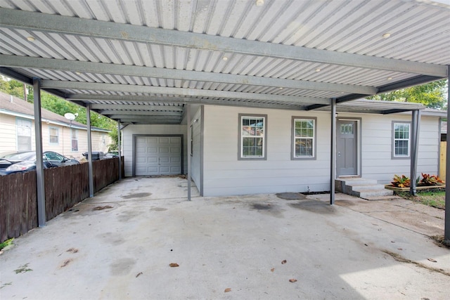 view of patio featuring a garage and a carport