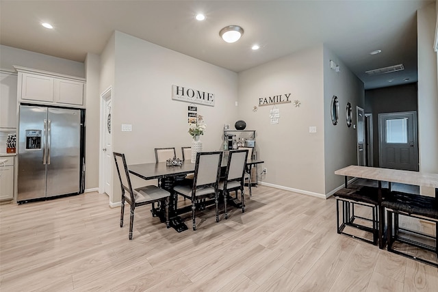 dining area with light wood-type flooring