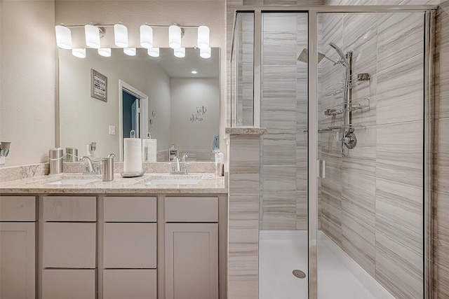 bathroom with vanity and an enclosed shower