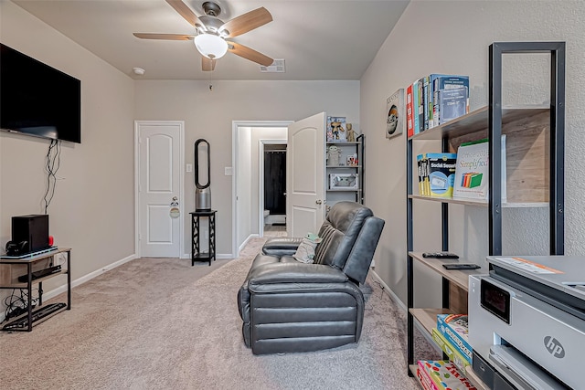 sitting room featuring ceiling fan and light colored carpet