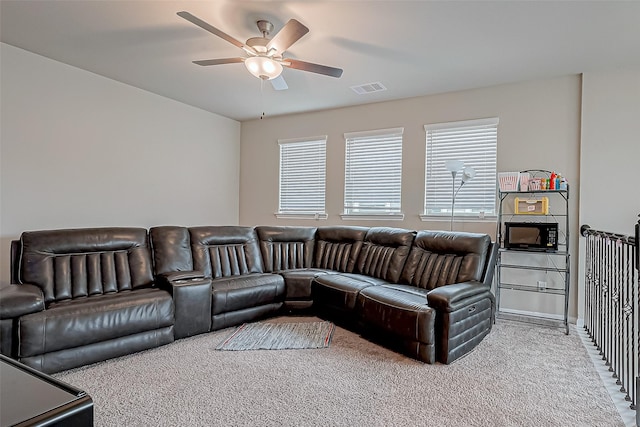 living room with carpet and ceiling fan