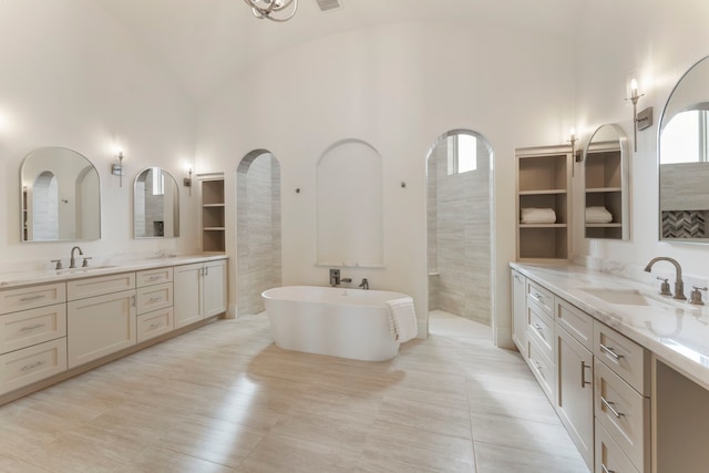 bathroom featuring tile patterned floors, vanity, lofted ceiling, and separate shower and tub