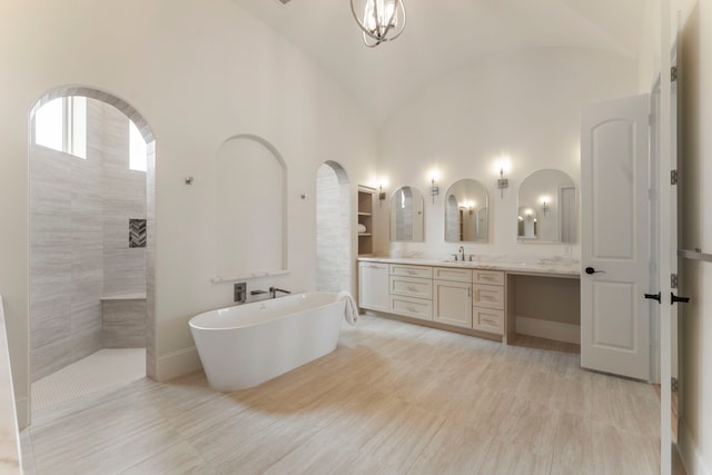 bathroom featuring separate shower and tub, vanity, and high vaulted ceiling