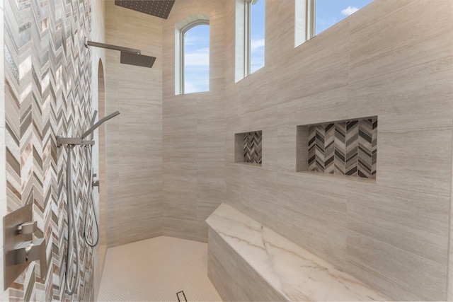 bathroom featuring tiled shower