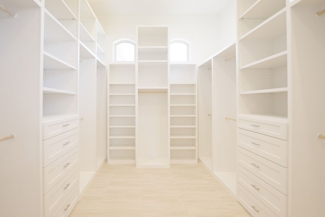 spacious closet featuring light hardwood / wood-style floors