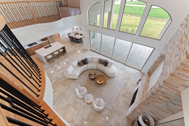 unfurnished living room featuring a high ceiling