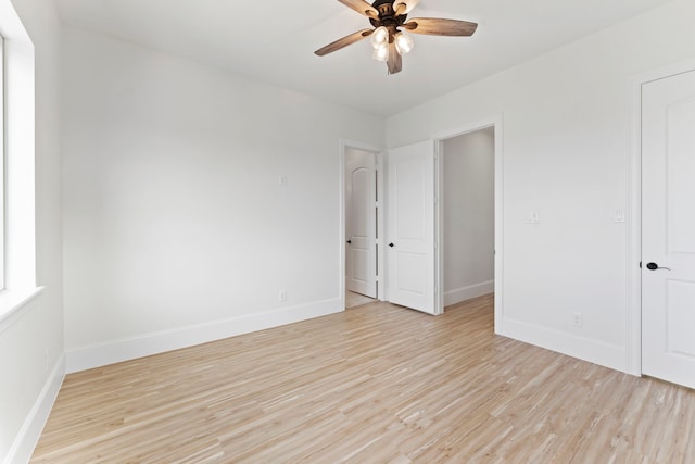 unfurnished bedroom with ceiling fan and light hardwood / wood-style flooring