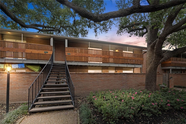 view of outdoor building at dusk