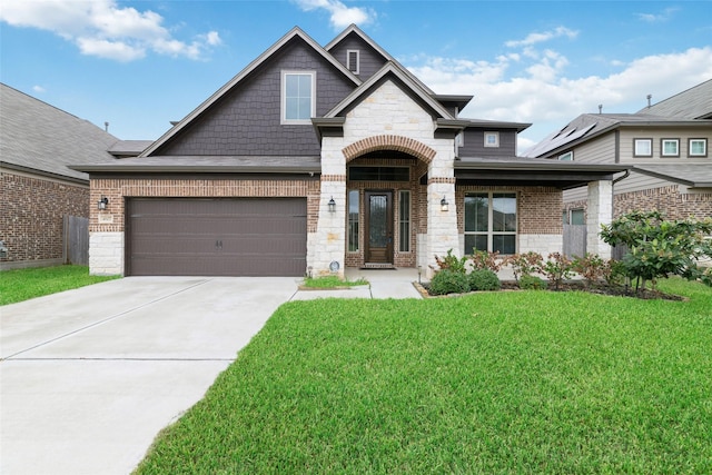 craftsman-style home with a front yard and a garage