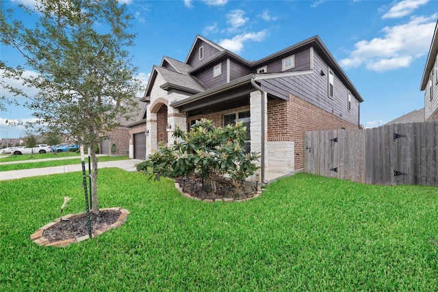 view of side of property with a garage and a yard