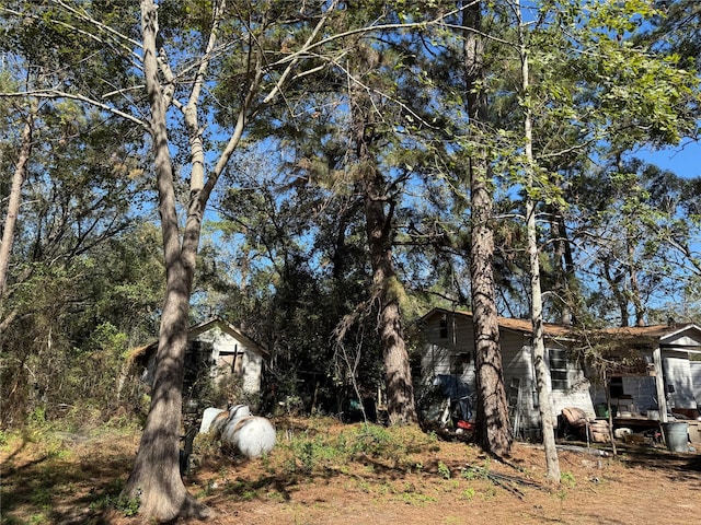 view of home's exterior with a storage shed