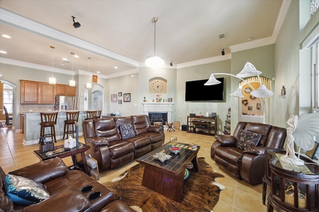 living room with crown molding and light tile patterned floors