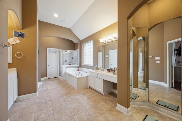 bathroom featuring tile patterned flooring, vanity, lofted ceiling, and shower with separate bathtub