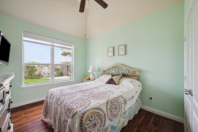 bedroom with ceiling fan and dark hardwood / wood-style floors