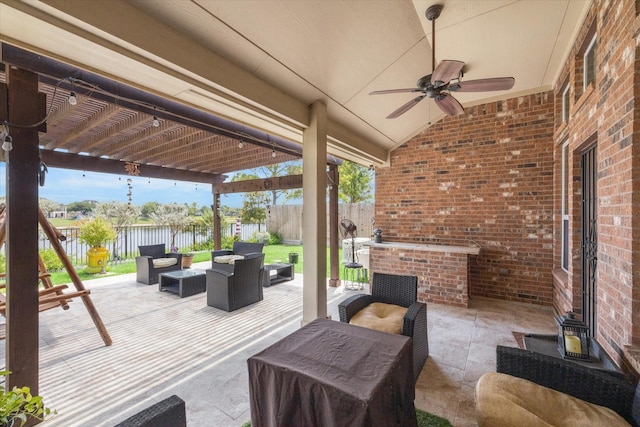 view of patio / terrace with a pergola, outdoor lounge area, ceiling fan, and a water view