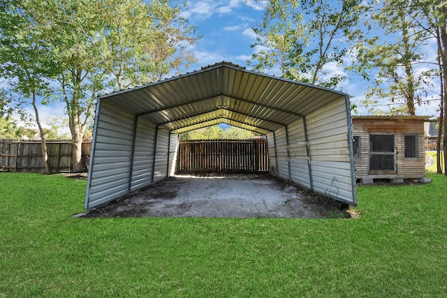 view of outdoor structure with a carport and a yard