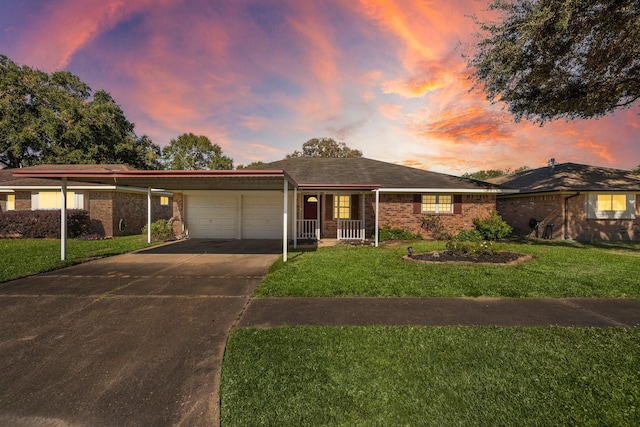 single story home with a garage and a lawn