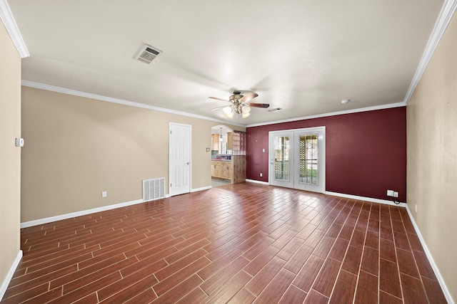 unfurnished living room with ceiling fan, ornamental molding, dark wood-type flooring, and french doors