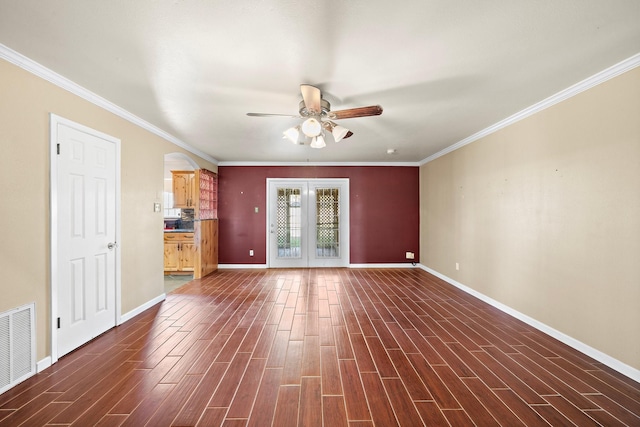 empty room with ceiling fan, french doors, dark wood-type flooring, and ornamental molding