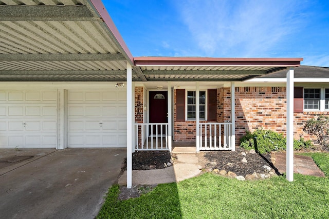 property entrance with a porch and a garage