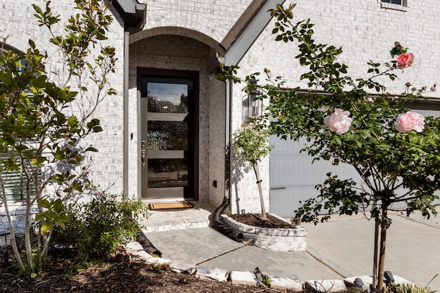 entrance to property featuring a garage