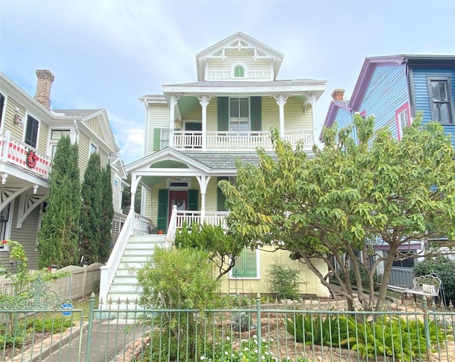 view of front of home with a porch and a balcony