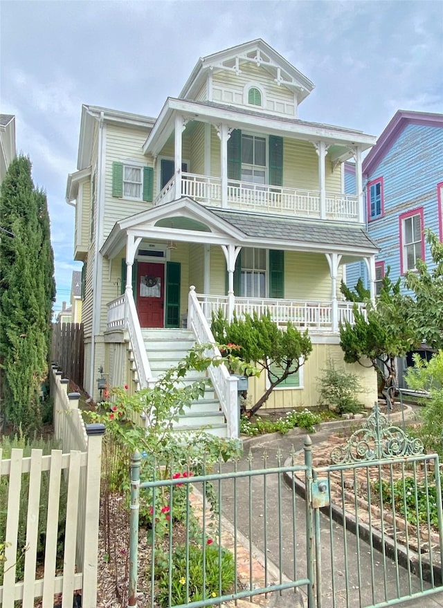 view of front facade with a balcony and covered porch