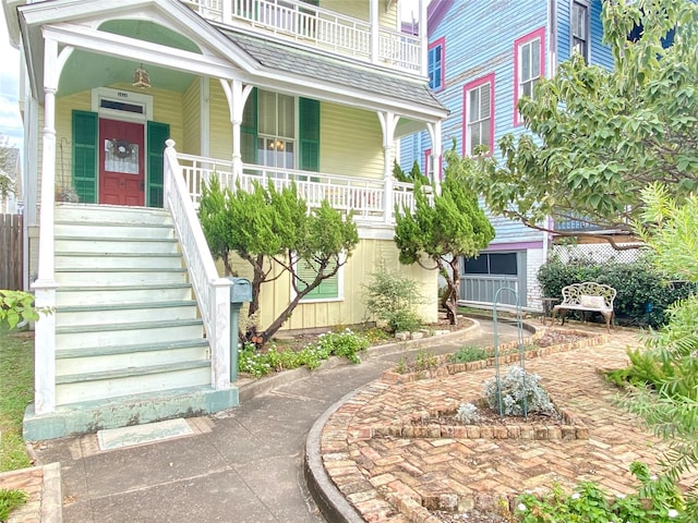 exterior space featuring a porch and a balcony