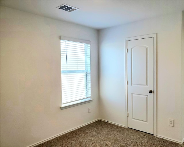 view of carpeted spare room