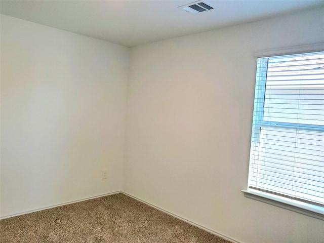 unfurnished room featuring carpet