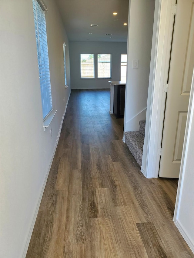 corridor with dark wood-type flooring