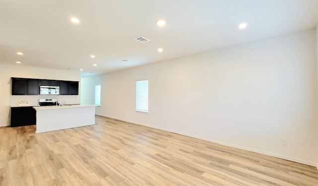 unfurnished living room with light hardwood / wood-style floors