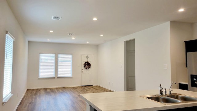 kitchen featuring sink and light hardwood / wood-style flooring