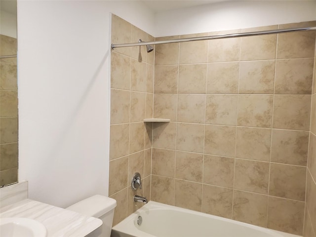 full bathroom with vanity, toilet, and tiled shower / bath combo