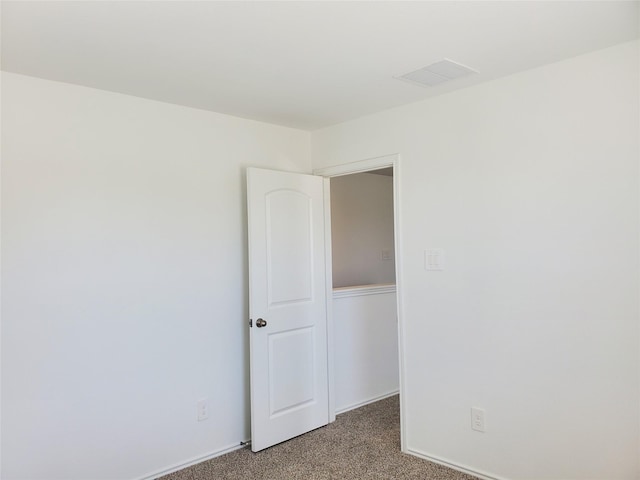 unfurnished bedroom featuring carpet