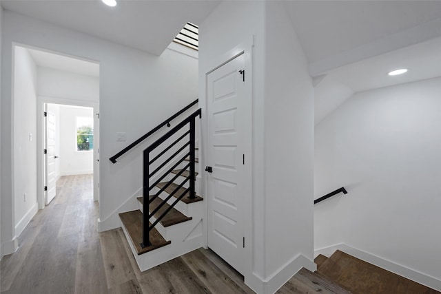 stairs with wood-type flooring