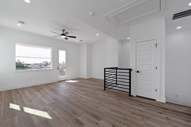 empty room featuring hardwood / wood-style flooring and ceiling fan