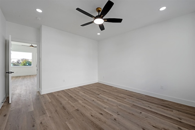 unfurnished room featuring light hardwood / wood-style floors and ceiling fan