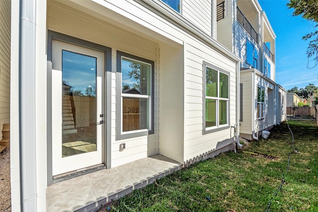 view of property exterior with a lawn