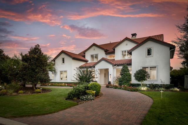 mediterranean / spanish-style house featuring a yard