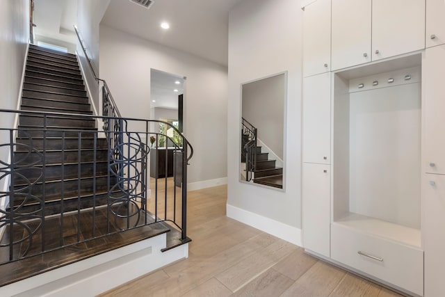 stairway featuring hardwood / wood-style floors